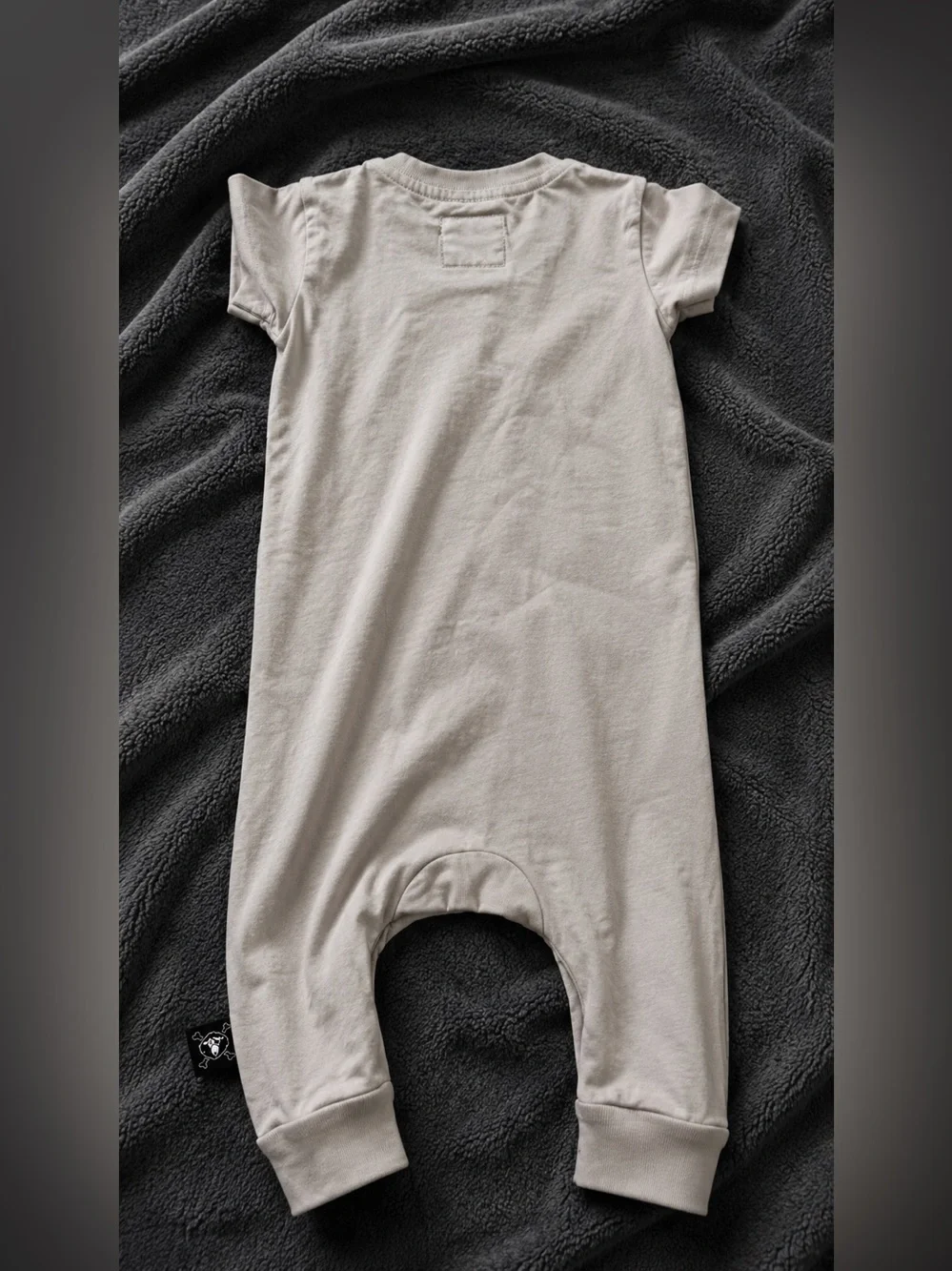 Nununu Beige Baby One-Piece with Skull Patch